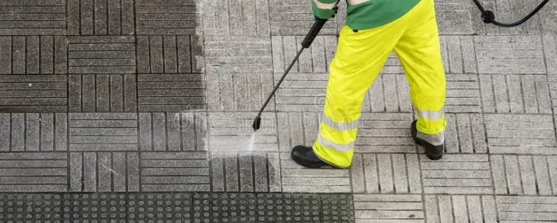 worker cleaning street sidewalk high pressure water jet worker cleaning street sidewalk high pressure water jet