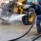Washing,Construction,Machinery,Off,Dirt,Before,Goes,Out,Of,The