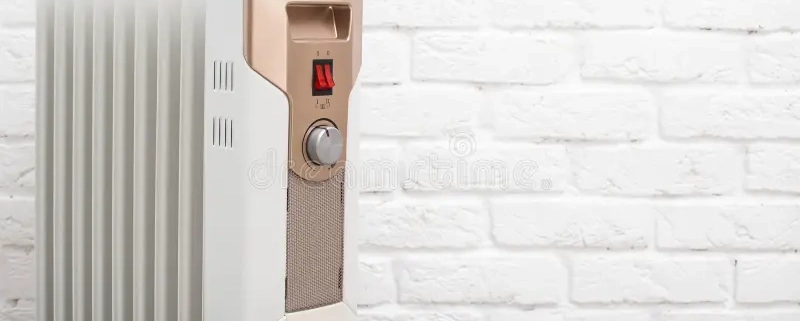 modern electric oil heating radiator against white brick wall concept turning apartments cold season autumn