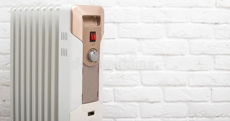 modern electric oil heating radiator against white brick wall concept turning apartments cold season autumn