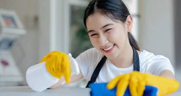 depositphotos stock photo asian female cleaner wiping tables